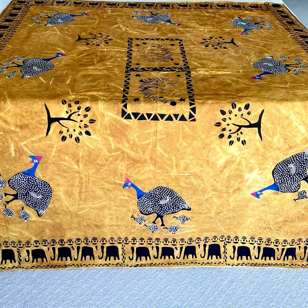 New from South Africa hand decorated table cloth with bird and elephant design.